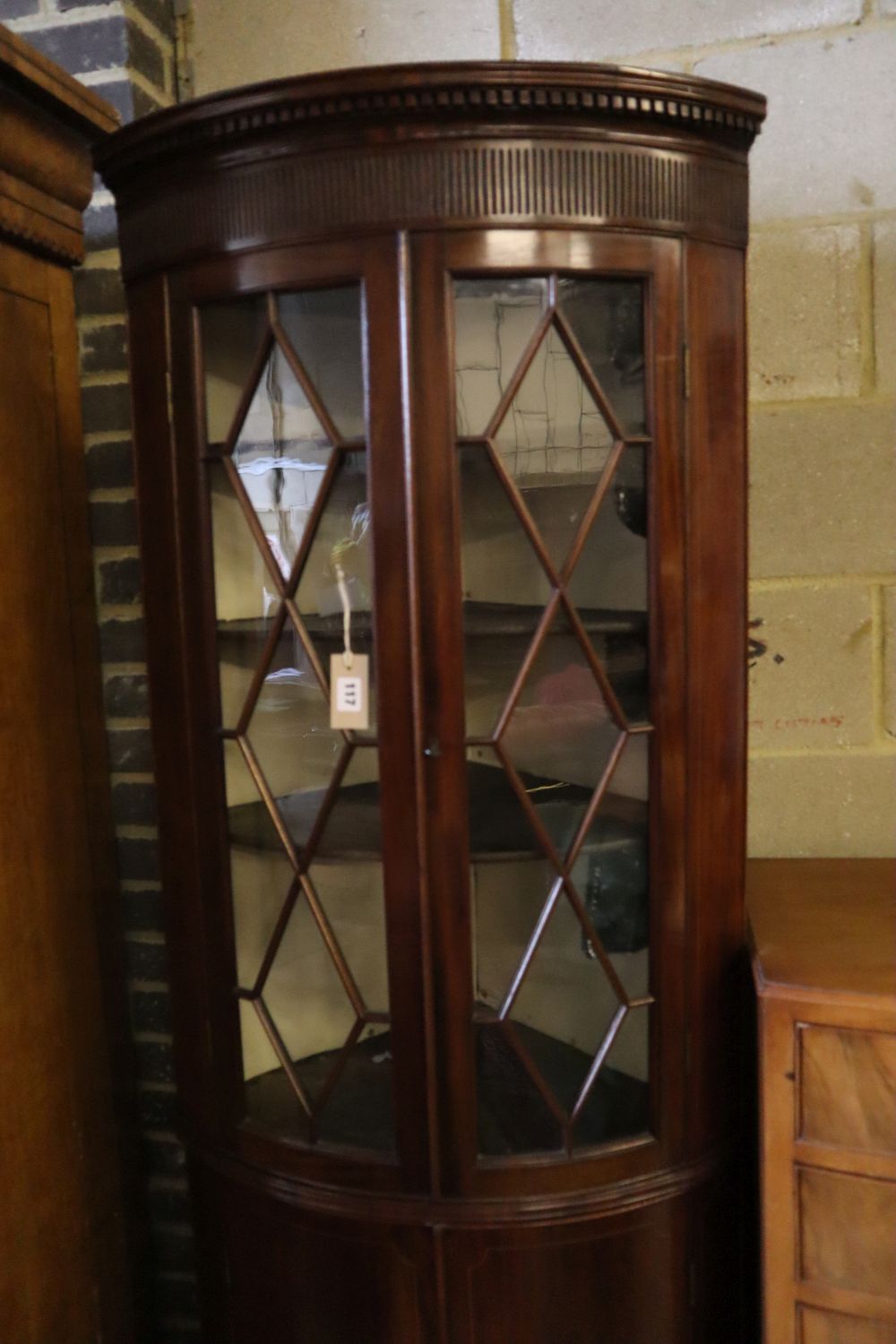 An Edwardian mahogany and boxwood-strung bow-fronted glazed corner cabinet, width 68cm depth 45cm height 208cm